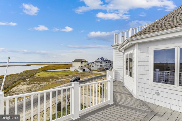 wooden deck with a water view