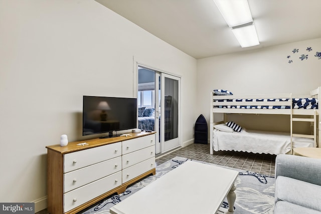 bedroom featuring baseboards