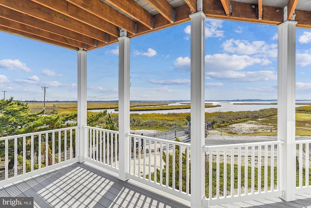 wooden terrace with a water view