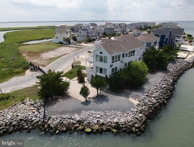 bird's eye view featuring a residential view and a water view