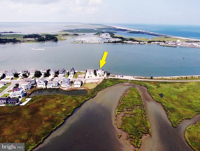 bird's eye view featuring a water view and a residential view