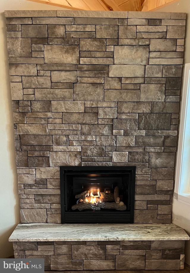 interior details with a stone fireplace