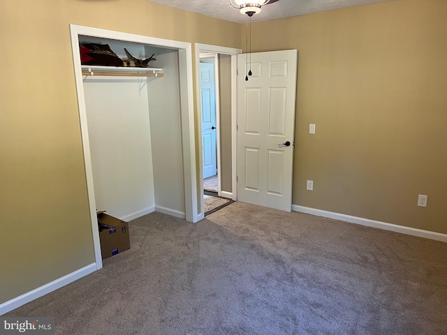 unfurnished bedroom with carpet floors and a closet