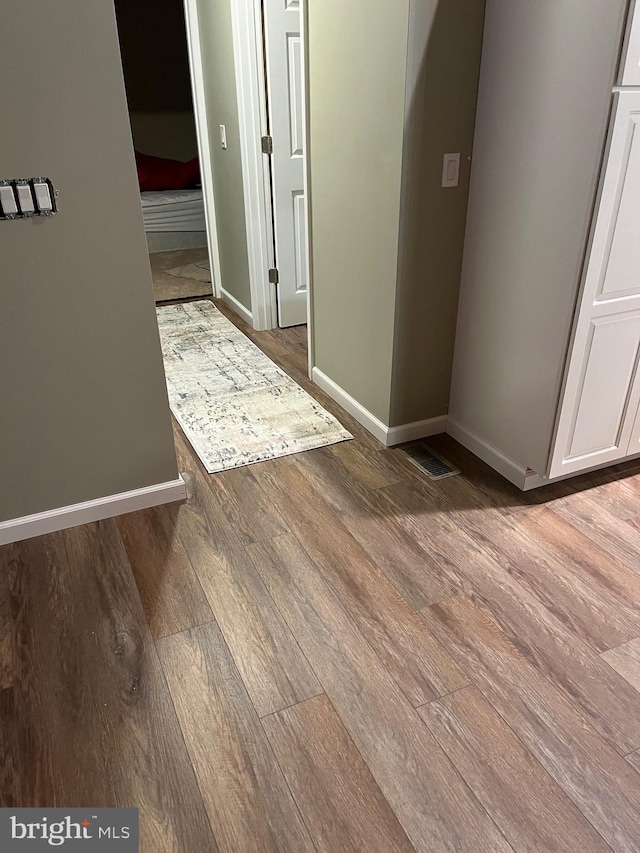 hallway with light hardwood / wood-style flooring