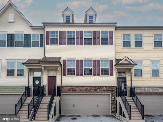 multi unit property featuring a garage