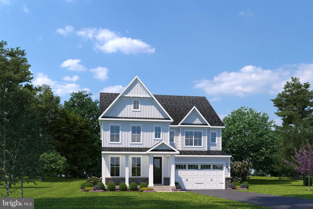 view of front facade featuring a garage and a front yard