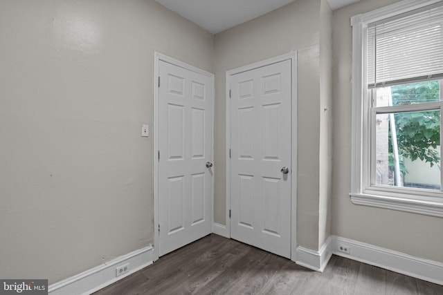 doorway with dark hardwood / wood-style flooring