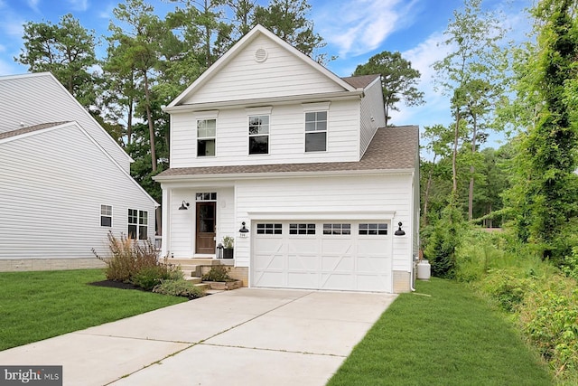 front of property featuring a garage and a front yard