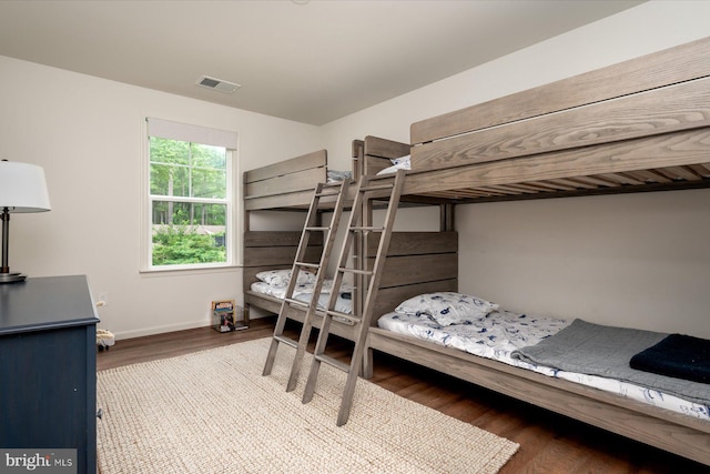 bedroom featuring wood-type flooring