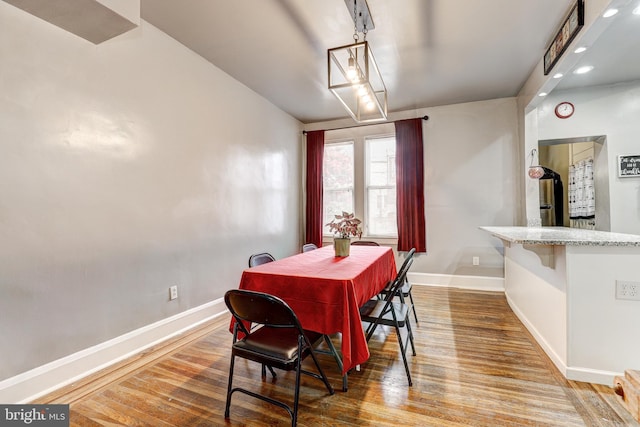 dining area featuring wood-type flooring