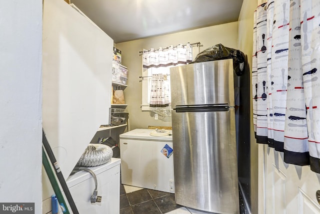 kitchen with stainless steel refrigerator, white cabinetry, and refrigerator