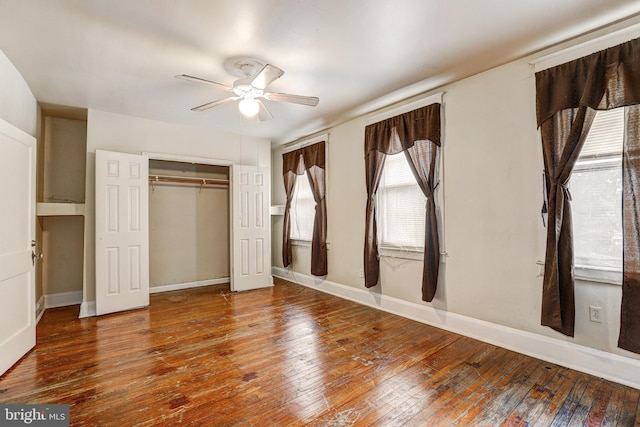 unfurnished bedroom featuring hardwood / wood-style floors and ceiling fan