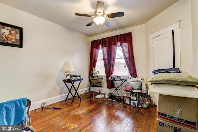 interior space featuring wood-type flooring and ceiling fan