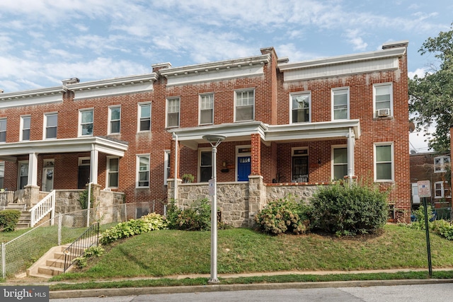 view of property featuring a front yard