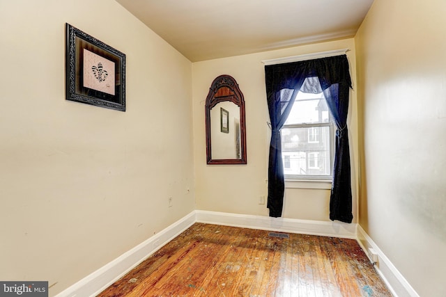 spare room with hardwood / wood-style flooring