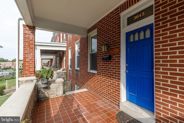 entrance to property featuring covered porch