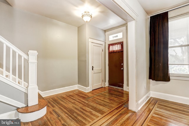 entryway with wood-type flooring