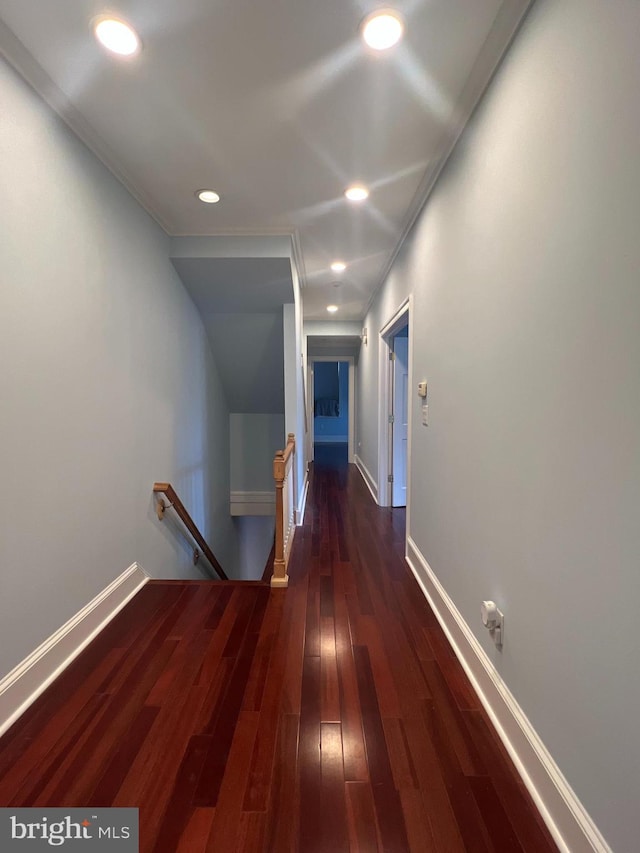 hallway with dark hardwood / wood-style flooring