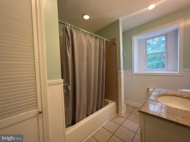 bathroom with shower / bath combination with curtain, tile patterned floors, and vanity