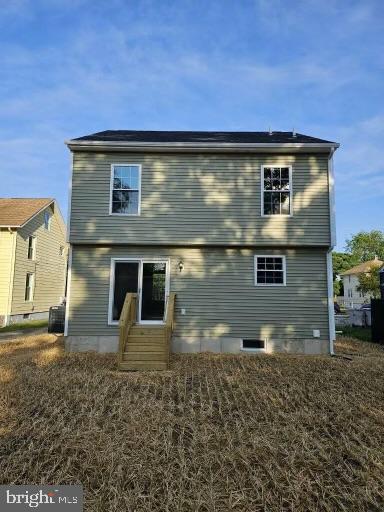 back of property featuring central AC unit