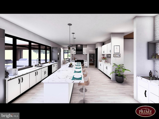 118 Hollow Horn Rd S Parcel, Unit South Parcel, Ottsville, PA 18942 - kitchen with sink, white cabinetry, a center island, pendant lighting, and light stone countertops