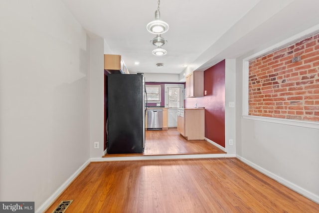 kitchen featuring appliances with stainless steel finishes and light wood-type flooring