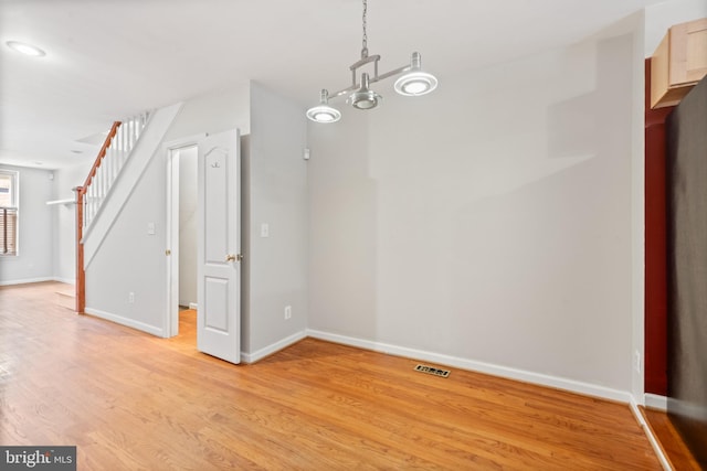 unfurnished dining area featuring light hardwood / wood-style flooring