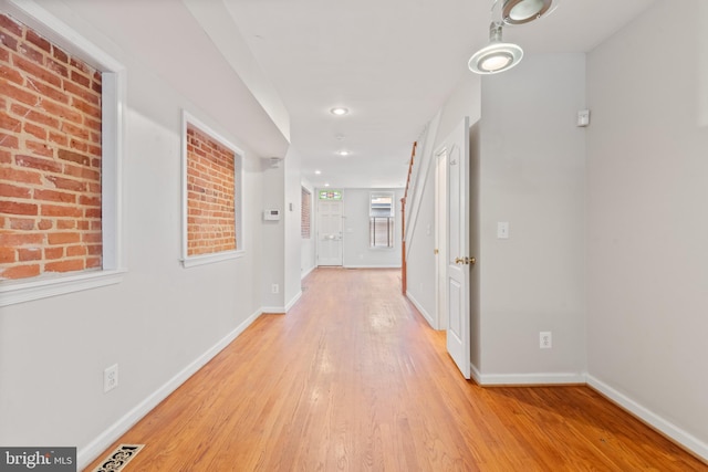 hall with light wood-type flooring