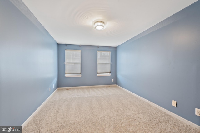 empty room with carpet flooring