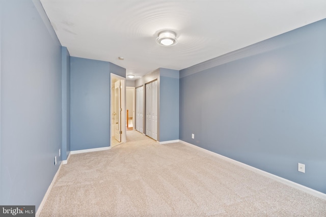 spare room with light carpet