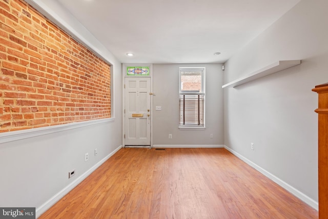 foyer with light wood-type flooring