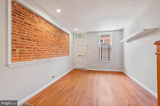 foyer entrance with light wood-type flooring