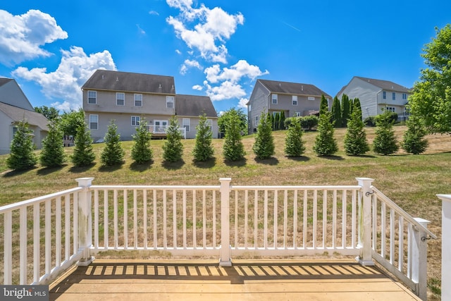 wooden terrace with a yard