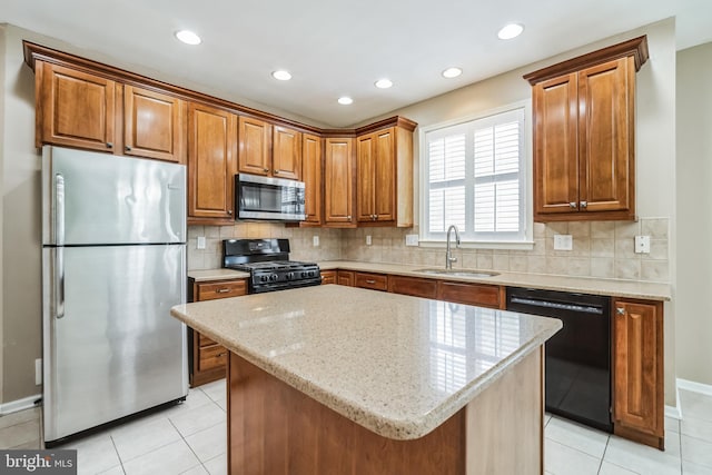 kitchen with light tile patterned flooring, a kitchen island, tasteful backsplash, sink, and black appliances