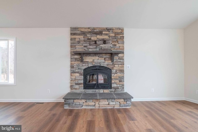 room details with visible vents, baseboards, and wood finished floors