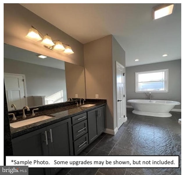 bathroom with vanity and a bathtub