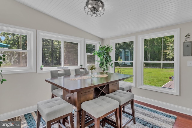 sunroom with wood ceiling, plenty of natural light, a chandelier, and lofted ceiling