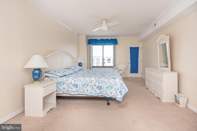 bedroom featuring ornamental molding, light carpet, and ceiling fan