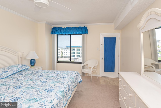 bedroom featuring ceiling fan, ornamental molding, light carpet, and a textured ceiling