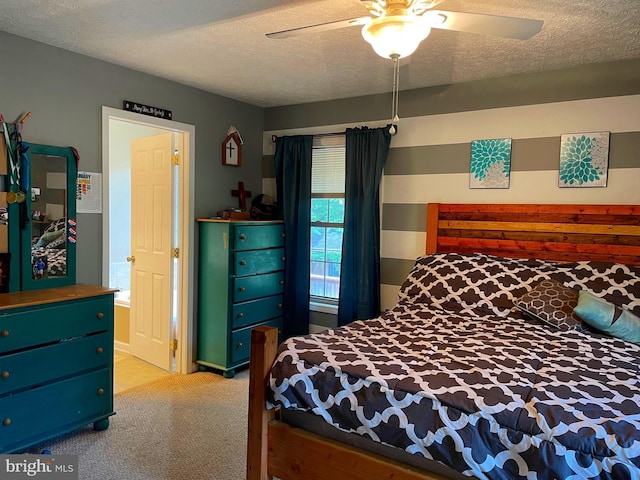 carpeted bedroom featuring ceiling fan and a textured ceiling