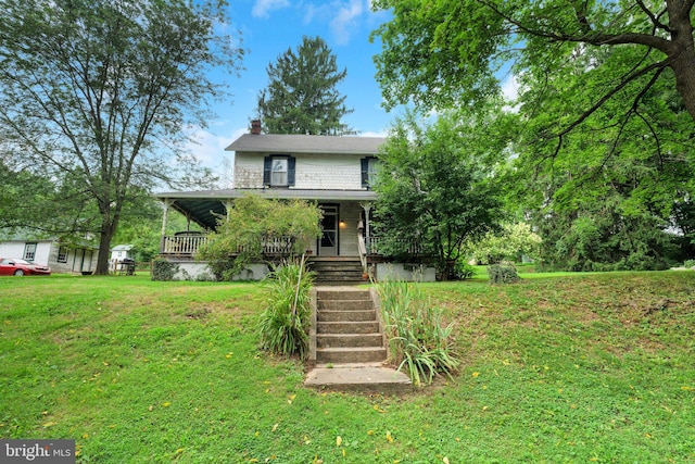 1757 Shadyside Rd, Downingtown, PA 19335 - view of front of house with covered porch, a chimney, stairway, and a front lawn