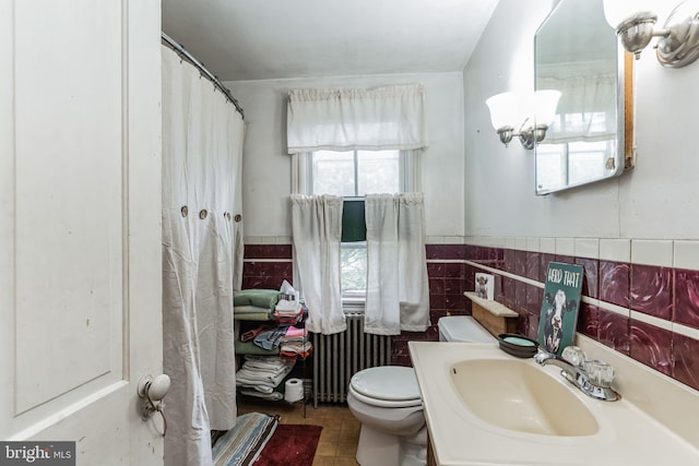 1757 Shadyside Rd, Downingtown, PA 19335 - full bathroom featuring tile walls, a wainscoted wall, toilet, radiator heating unit, and tile patterned flooring