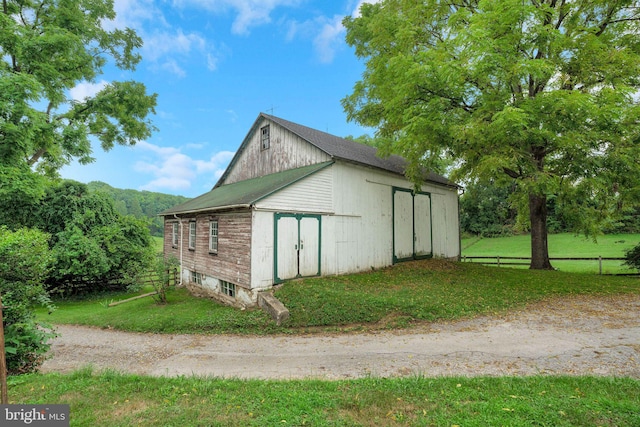 1757 Shadyside Rd, Downingtown, PA 19335 - view of outdoor structure featuring dirt driveway, an outbuilding, and fence