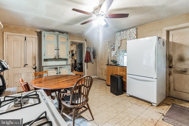 1757 Shadyside Rd, Downingtown, PA 19335 - kitchen featuring freestanding refrigerator, light floors, dark countertops, and ceiling fan
