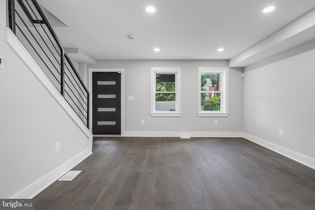 foyer with wood-type flooring