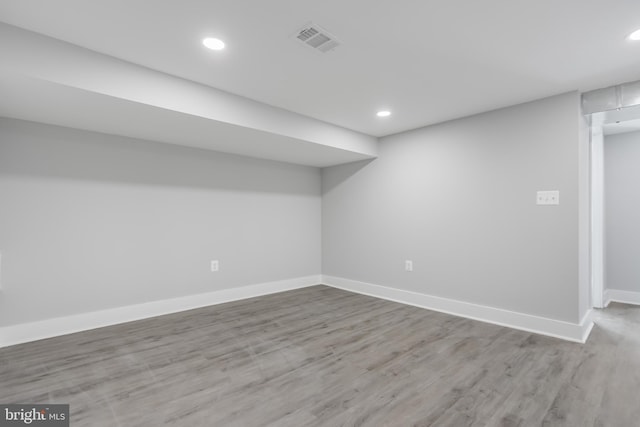 basement featuring wood-type flooring