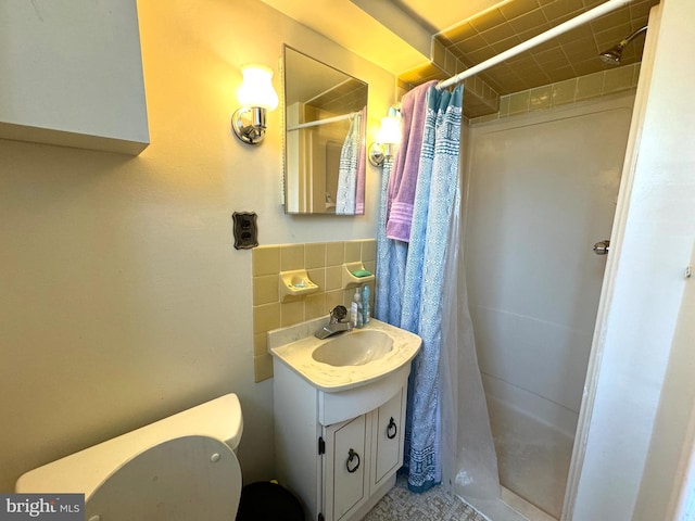 bathroom with decorative backsplash, vanity, tile walls, toilet, and a shower with curtain