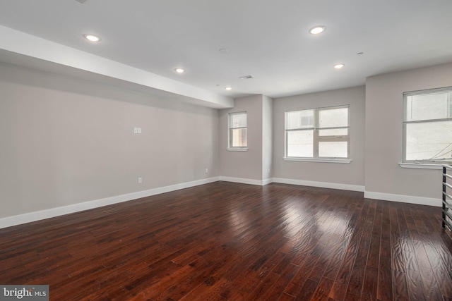 unfurnished room featuring dark wood-type flooring