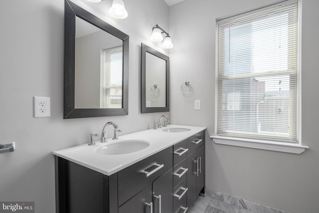 bathroom with vanity and plenty of natural light