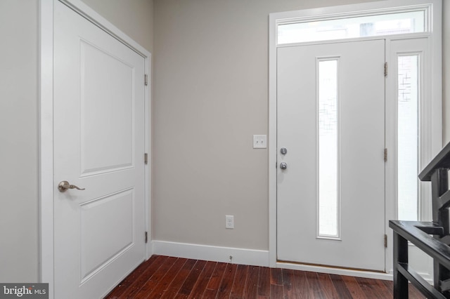 foyer entrance with dark hardwood / wood-style flooring